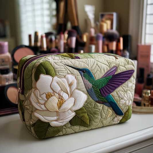 Beauty case trapuntato con colibrì nel prato